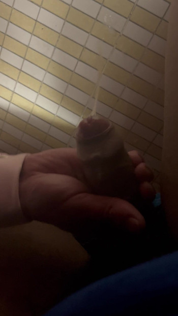 Under-stall bathroom handjob and cum shot