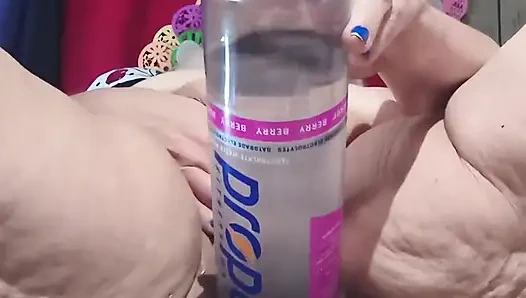 Big Bottle Plugged Clit Cunt