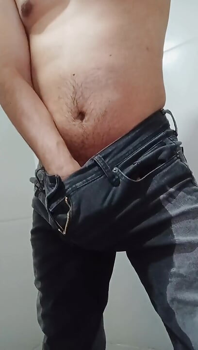 Urinating in Dark Jeans