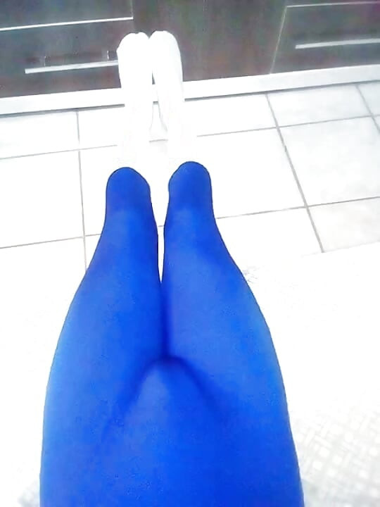 Fun at home wearing a blue Zentai costume with socks