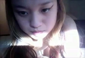Asian girl nice tits works over her pussy with toy