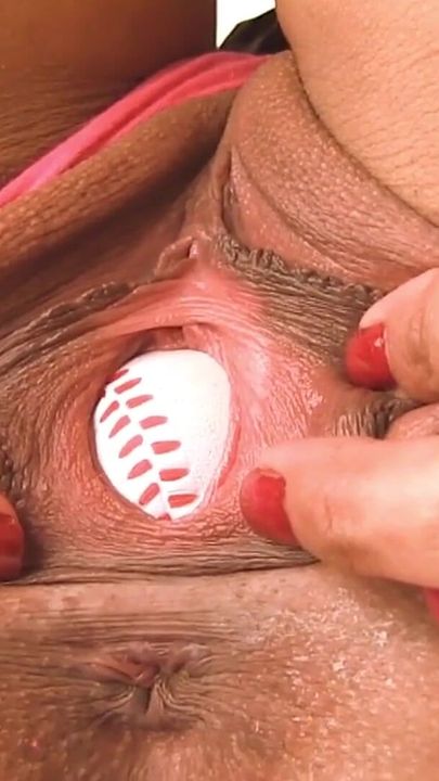 Amateur Latin with Mini Skirt Plays a Baseball in Her Big Pussy