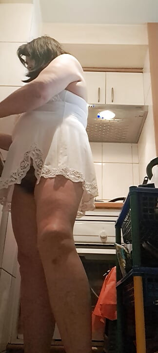 washing dishes without underwear and something small showing her pussy mom in the kitchen