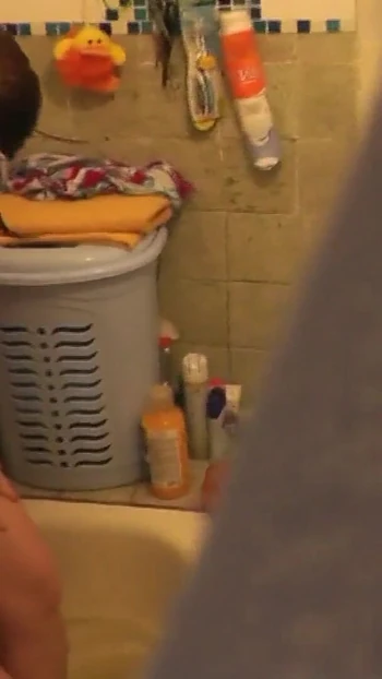 Must-see moment from "Stepmom goes to bathroom, wanks pussy, student stepson watches"