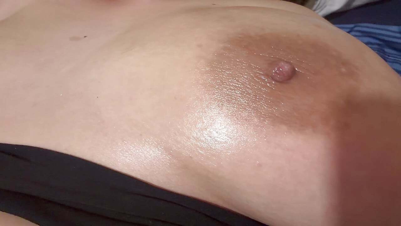 Sexy mommy massages her huge tits full of delicious oil