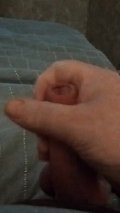 My friend's boyfriend is lying in bed jerking his cock while we watch and have an orgasm | Clip 2