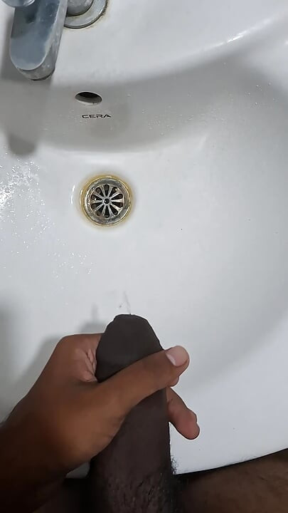 Peeing while jerking in bathroom