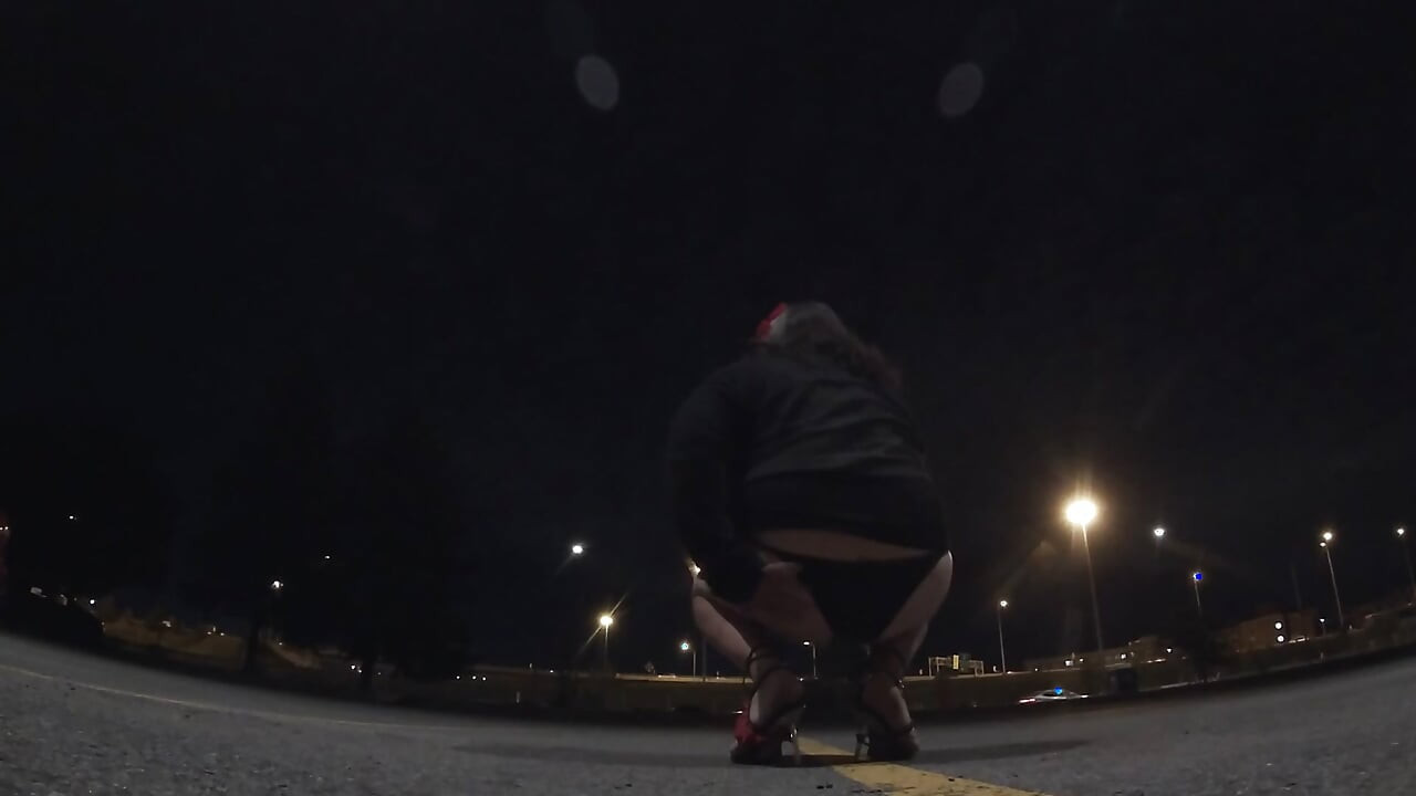Midnight whore CD is walking around a car parking lot lookking to get lucky