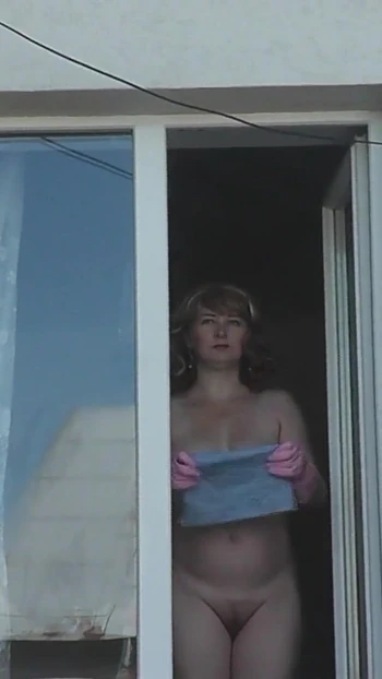 Must-see moment from "Neighbor taxi driver from looks at neighbor MILF who washes window of apartment naked. Nude in public"