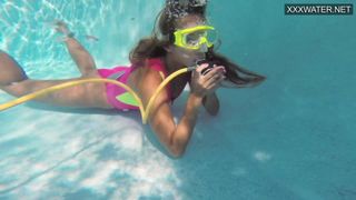 Cute teen Irina Poplavok swims naked underwater