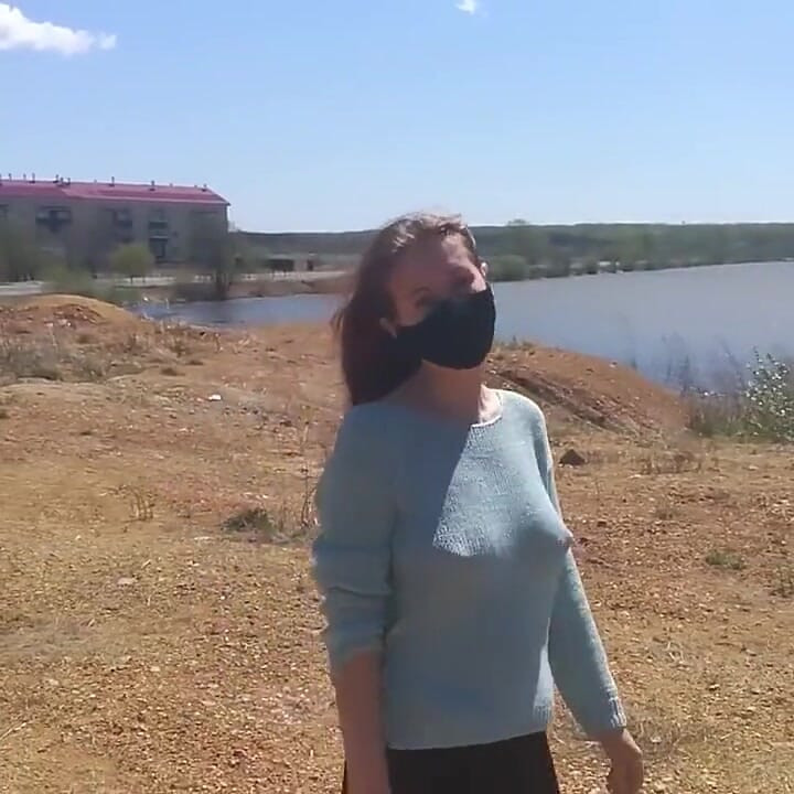 Girl undresses on a windy day