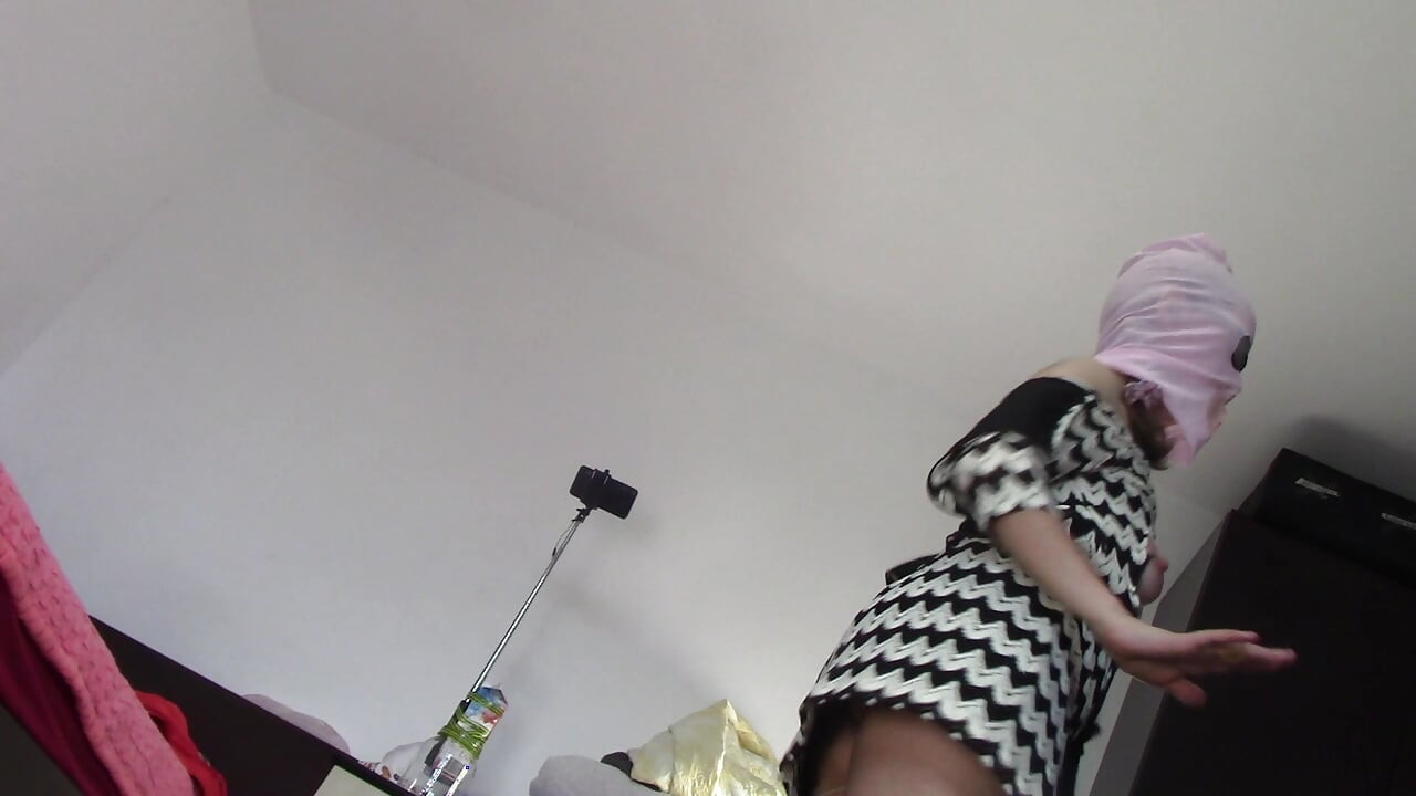 Amateur wife dancing naked at home. Amateur woman has fun trying on clothes and cutting them