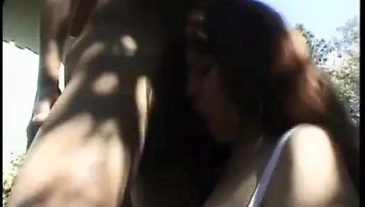 Bisexual threesome with stunning brunette and two hot studs fucking outdoors