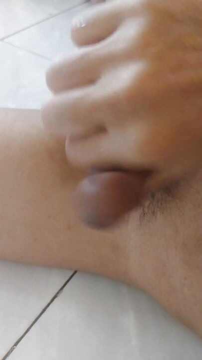 handsome asian guy jerking off in his office