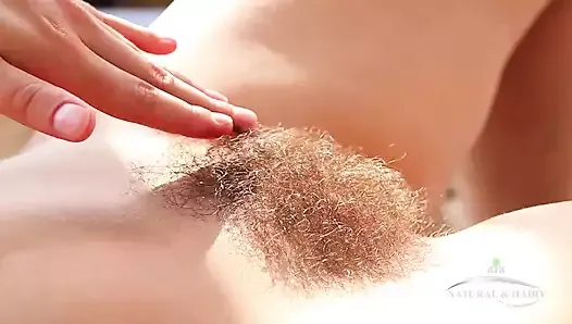 Sexy model Audrey strips down showing off her hairy pussy