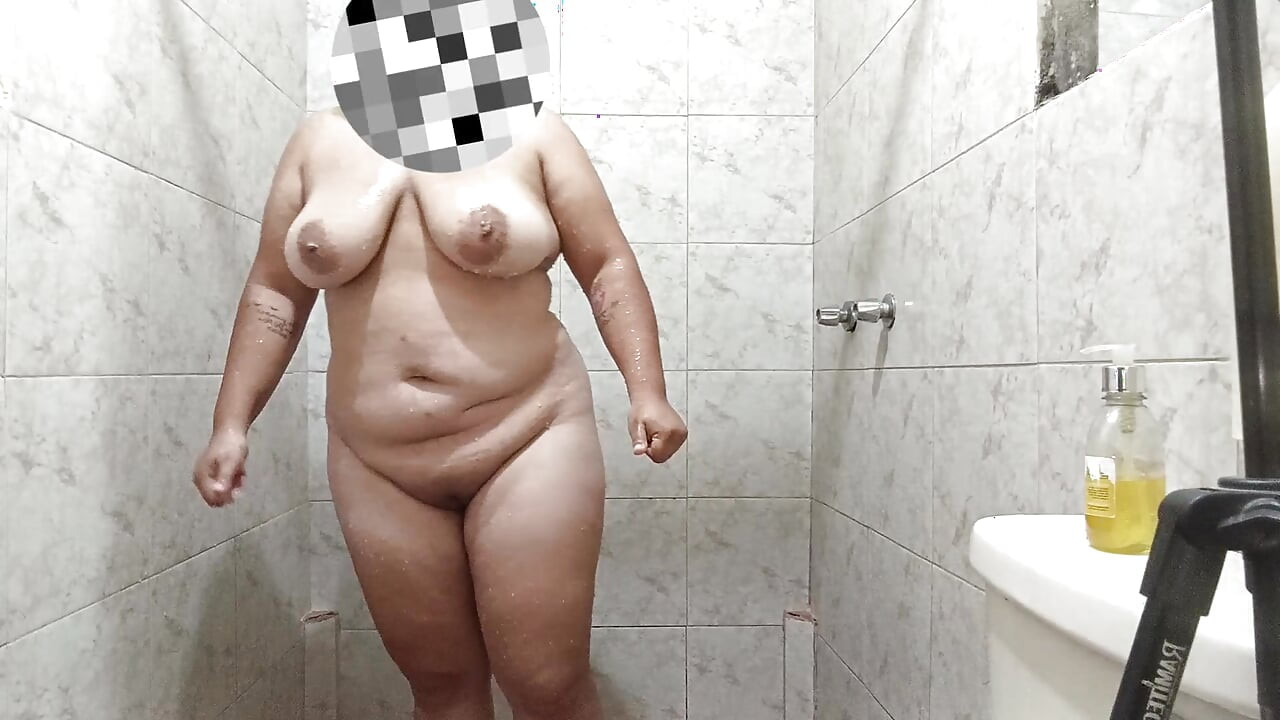 Sexy Latin girl touches herself very rich while showering rich and has giant breasts.