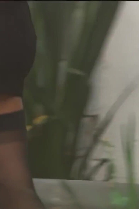 This brunette secretary looks wonderful while having very arousing sex in a beautiful garden