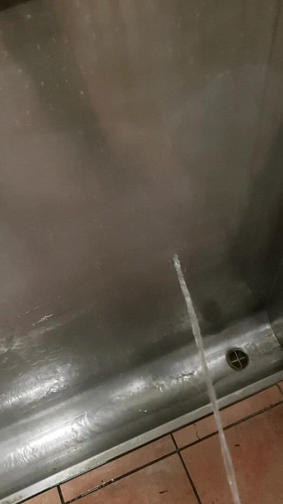 pissing in a public restroom