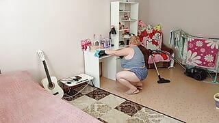 Mother-in-law vacuums the room naked