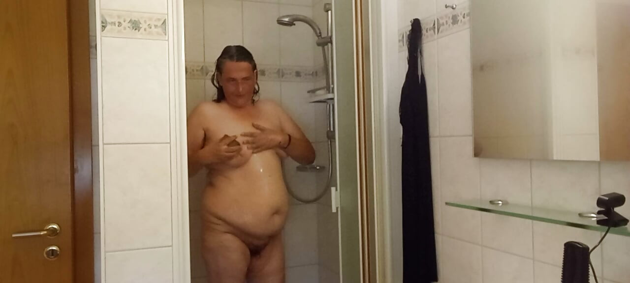 Chubby mature woman in the shower - soft belly - part 2