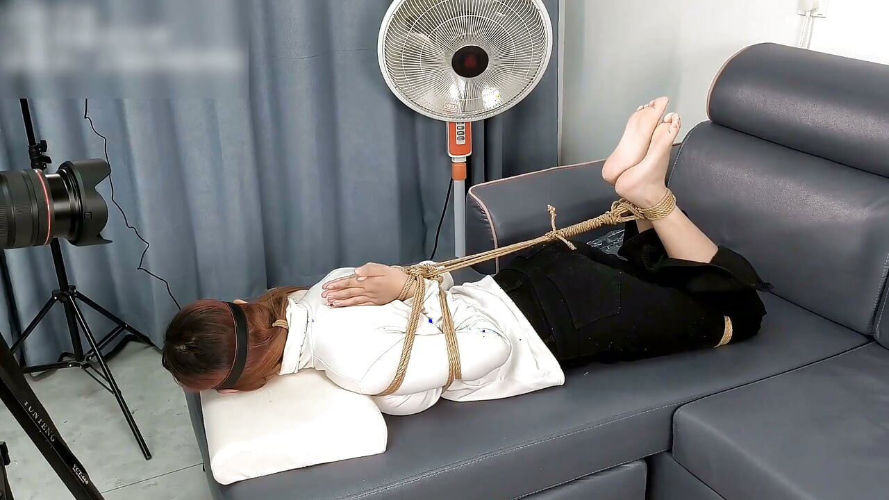The Extreme Restraints of a Barefoot Girl, Playing with Her Bare Feet