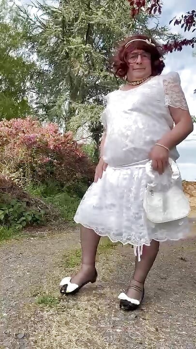 Dressed in a white lace dress for a day