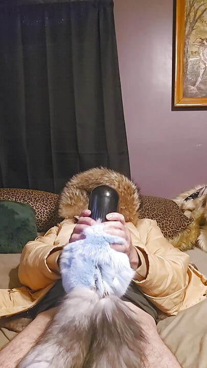 In my big furry hood using penis pump wrapped in furs and tails