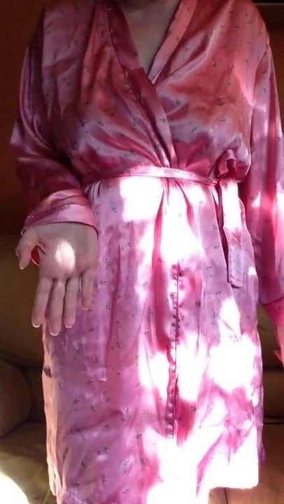 Taking pink dressing gown and my black pants off