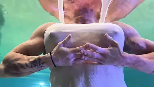 Amazon Kandy Flexes Her Massive Biceps in Her Hotel Pool