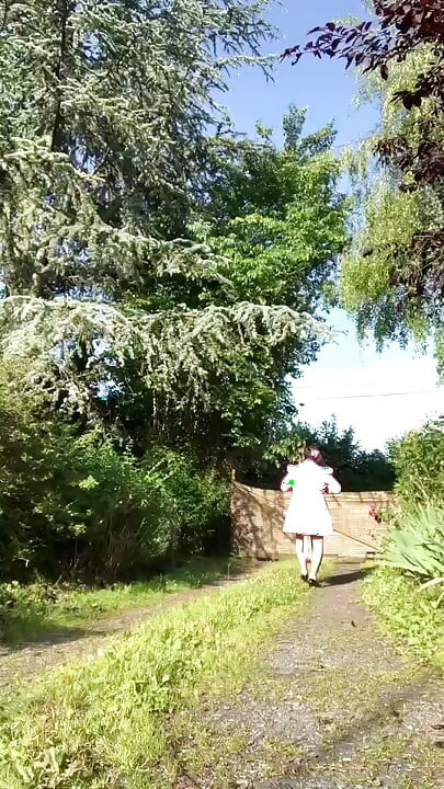 In an outfit with a little pink button dress for an evening.