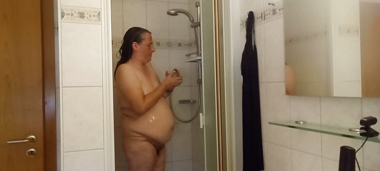 Chubby mature woman in the shower - soft belly - part 2