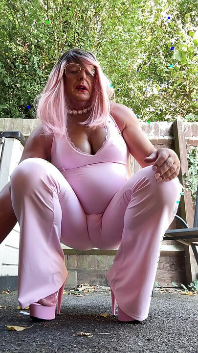 Crossdresser kellycd2022 in pink jumpsuit and heels