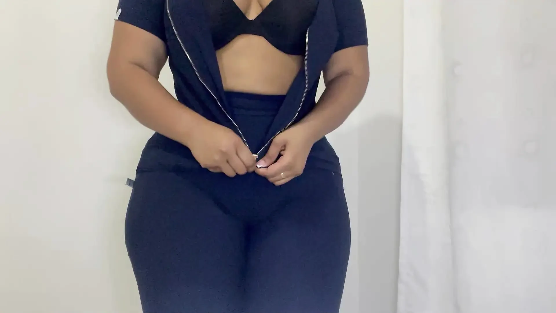 VOLUPTUOUS NURSE SHOWING HER TRANSPARENCIES IN FRONT OF THE CAMERA