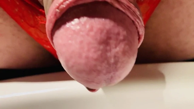 Pissing in latex and red thong