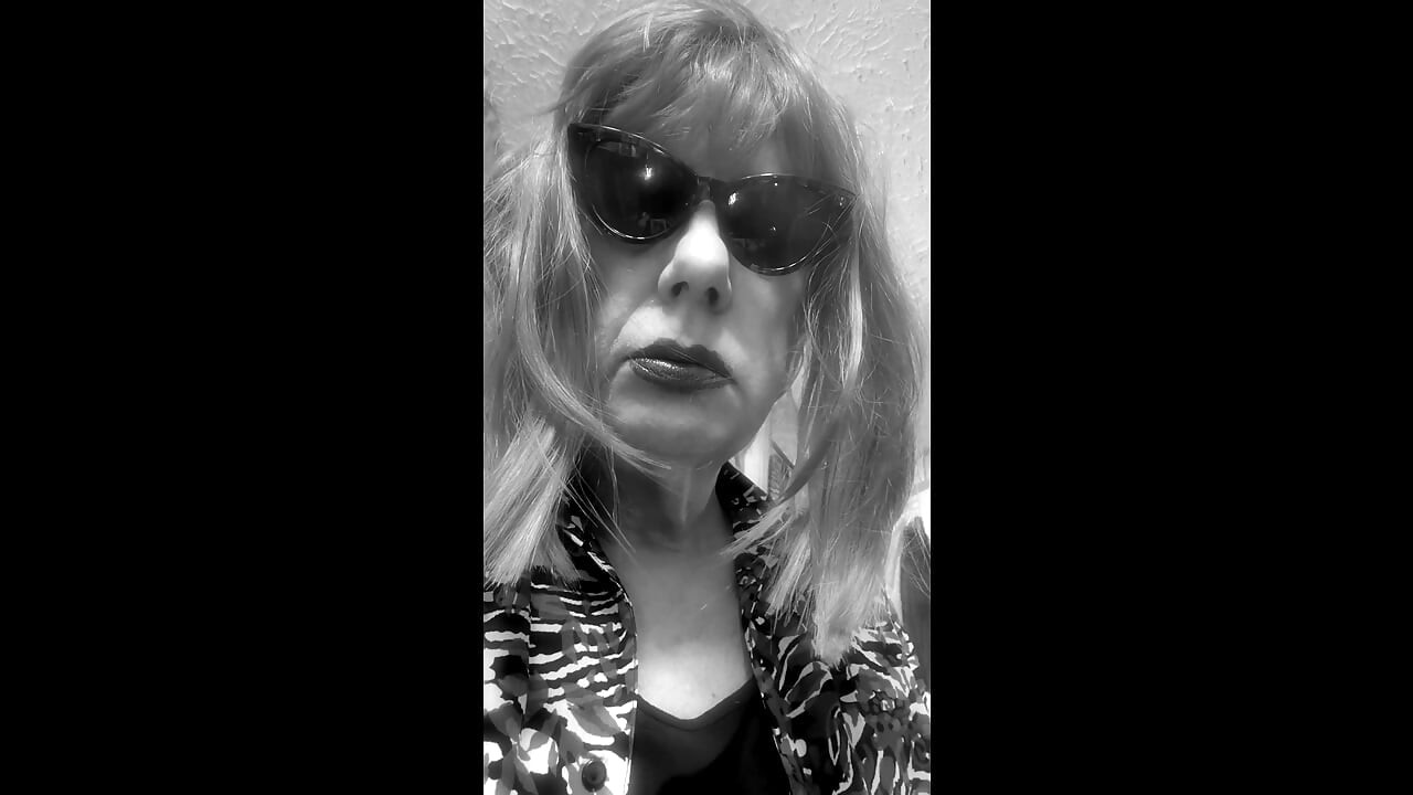 MRS. ROMAN DESTROYING A MARLBORO 100 MENTHOL CLOSE UP - WITH DANGLING AND NOSTRIL EXHALES
