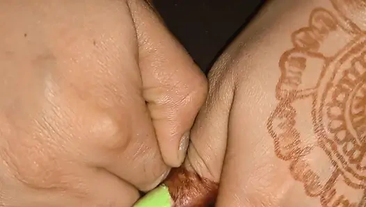 A lesbian fingering her pussy.