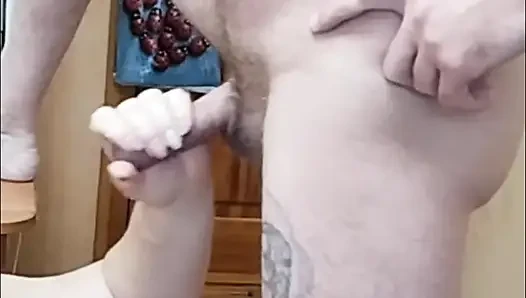Fat woman jerks off my cock to a cumshot taking cum on herself. Close up