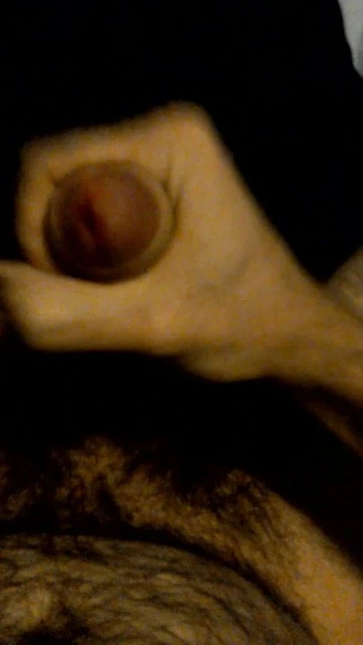 Hairy guy with painted nails wanks big uncut cock and cums