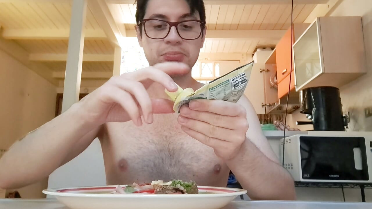 Pig guy eats a sandwich while jerking big cock