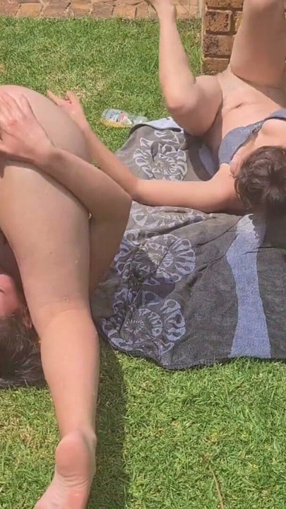 Two slutty friends squirting water out of their asses outside in the garden | Clip 1
