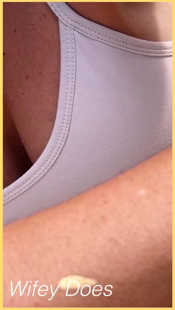 Wifey shows perfect cleavage in this tight white sports bra check out this hot MILF amazing cleavage