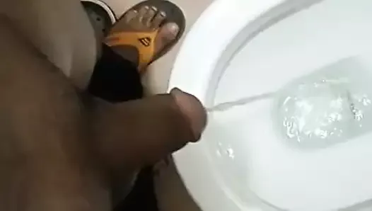 Indian daddy pissing in the bathroom