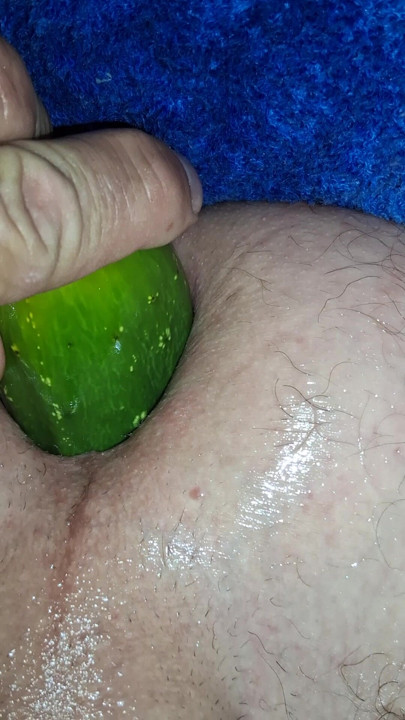 Enjoying cucumber in the ass