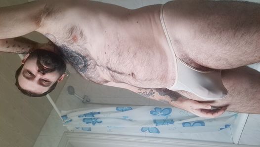 bear takes a shower, dries his hairy body and puts on a thong with his big ass