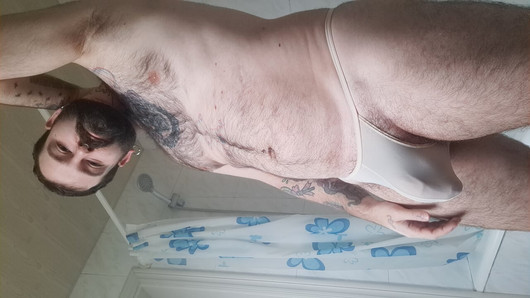 bear takes a shower, dries his hairy body and puts on a thong with his big ass