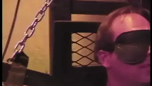 Stud gets blindfolded while busty redhead latex dom has her way with him