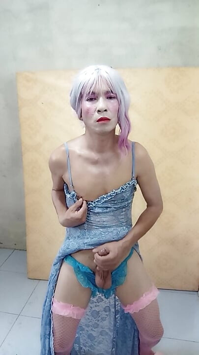 Oanh Le shemale eyes sexy dress porn standing with a happy cock leaning on her back