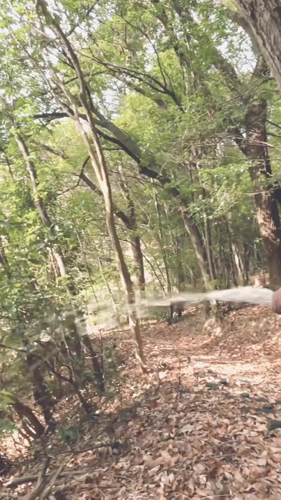 A boy with a small foreskin pees a huge stream outdoors | Clip 1