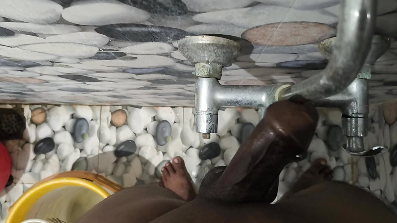 A man masturbating by stroking his penis.