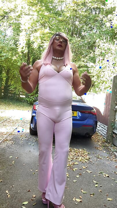 Crossdresser kellycd2022 in pink jumpsuit and heels